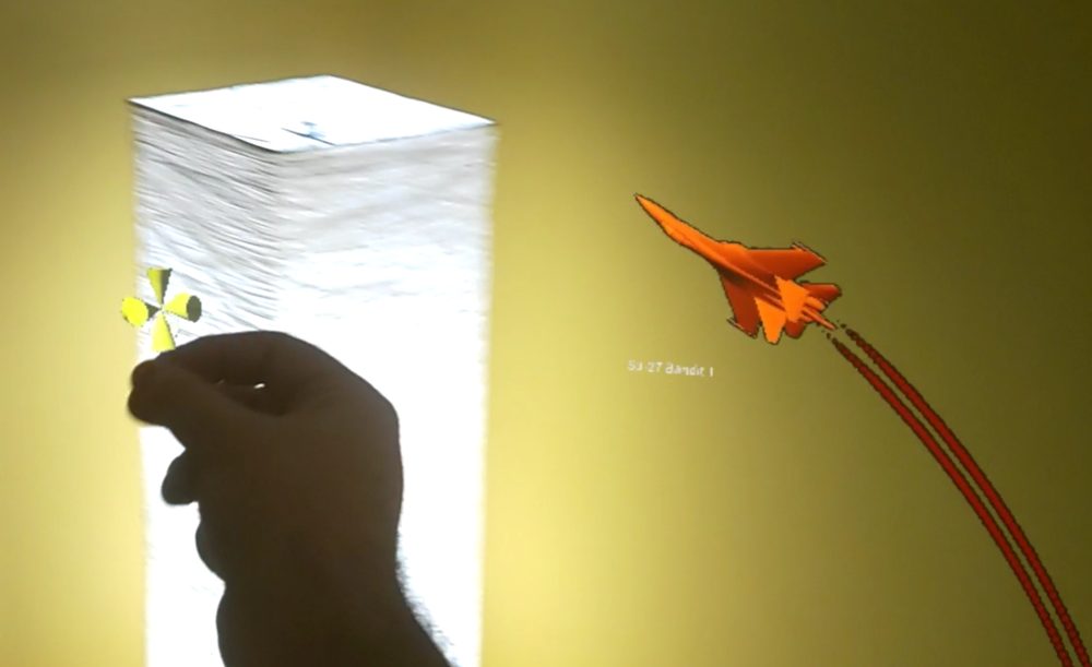 Hand gesture spawning an aircraft unit in mixed reality