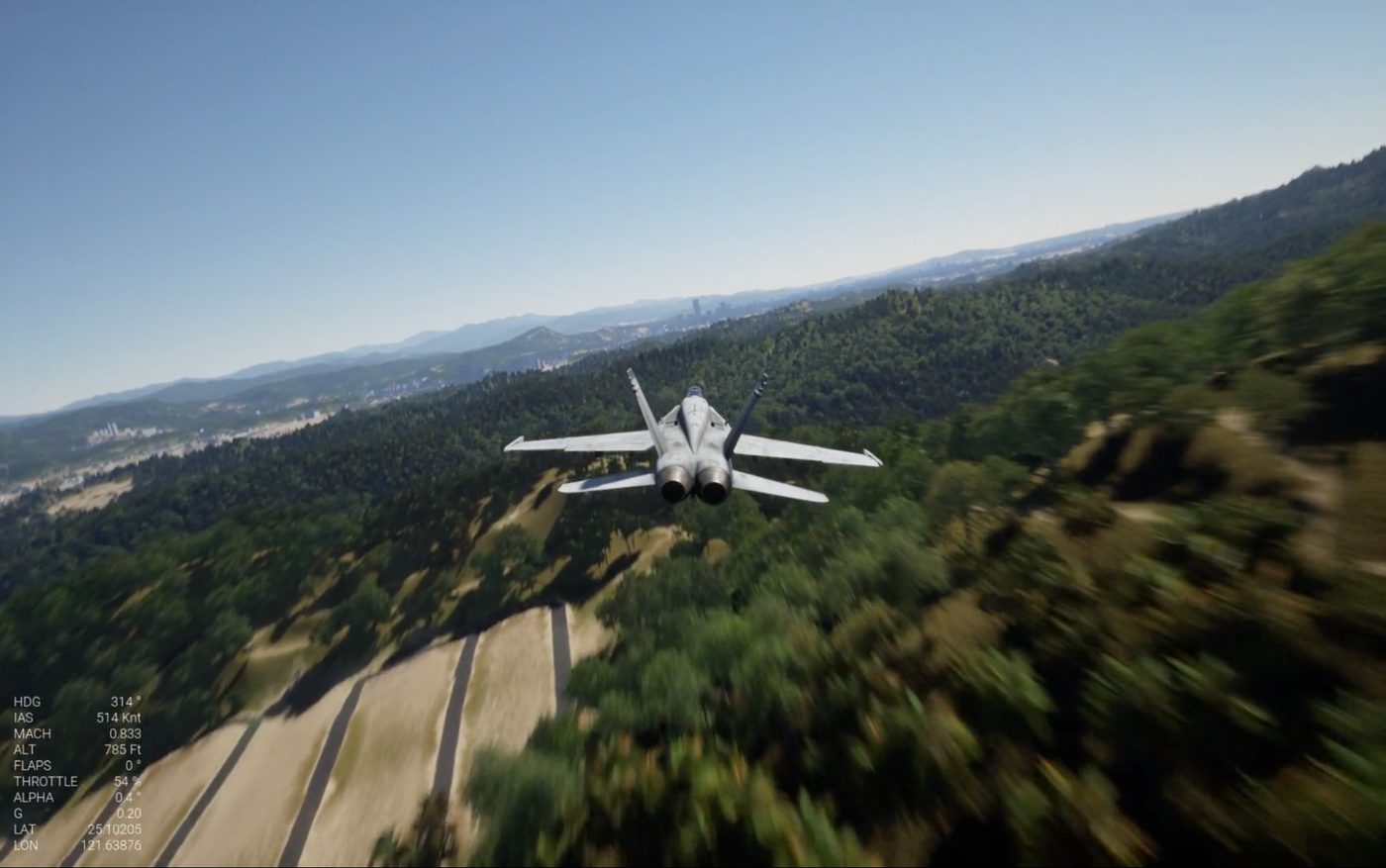 Jet trainer flying low over terrain